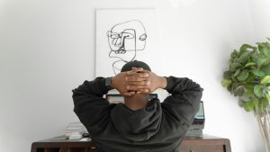 Men in front of desk from the back